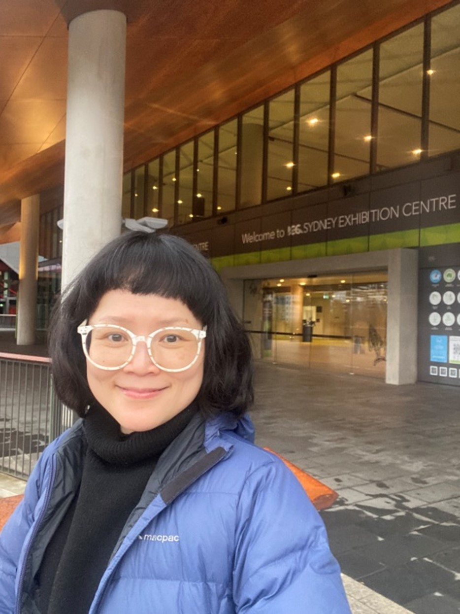 Women in AI Scholarship recipient, Dr Ariel Kam Ha Lui outside the Sydney Exhibition Centre
